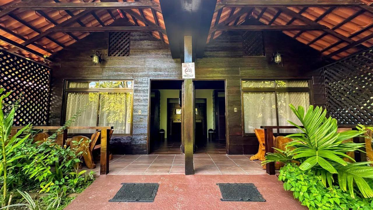 La Fortuna Waterfall Bungalows: front porch of two bungalows with wooden lattice